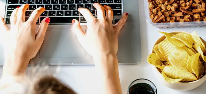 Stress Eating Junk Food at Computer